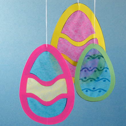 Egg-shaped suncatchers with two colors of tissue paper