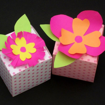Paper flowers on gift boxes
