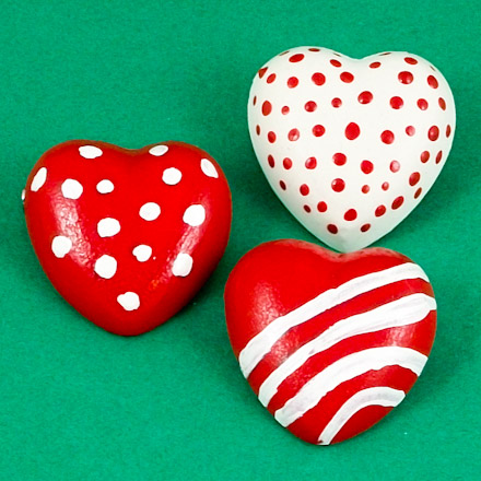 Simple heart shaped pins painted with red and white