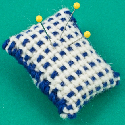 Make a pincushion from the bookmark fabric