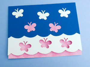 Glue scalloped cardstock and paper punches to front of card