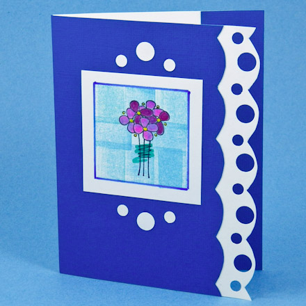 Scalloped edge card with hole punches in two sizes along the edge