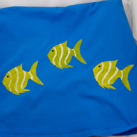 T-shirt stenciled with two-part fish stencil