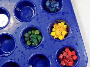 Fill mini-muffin wells with bits of crayons