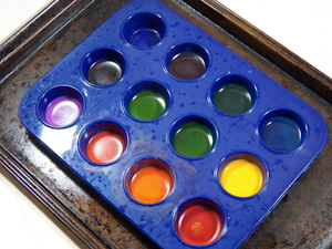Mini-muffin tin with melted crayons