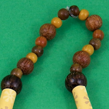 Tie a knot in elastic cord and bury the ends in the beads