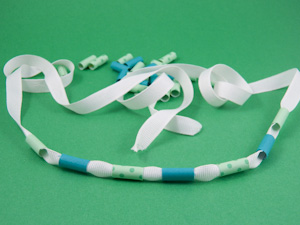 String beads on ribbon