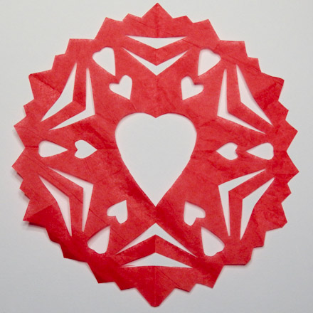 Snowflake with heart cut in center