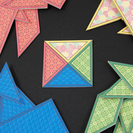 Four tangram sets with Chinese designs