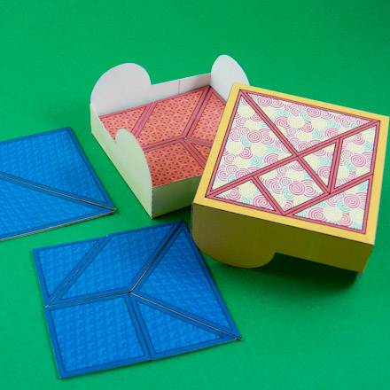 Tangram box with tangram puzzles