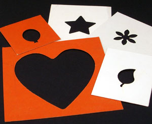 Embossing templates cut or punched from cardboard