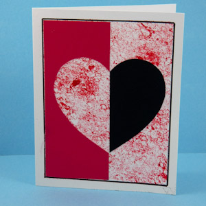 Card with red and black heart silhouettes