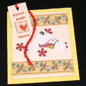 Pocket card with cream pockets and ribbon decoration.