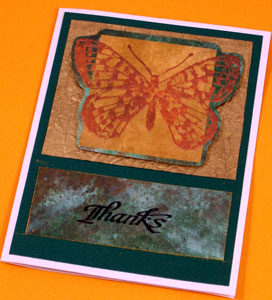 Card made using recycling technique #3 - a golden butterfly fussy-cut and matted