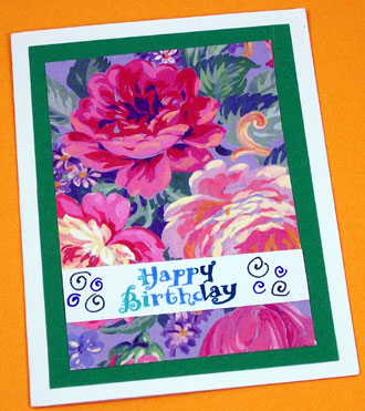 Matted flowers with Happy Birthday message strip