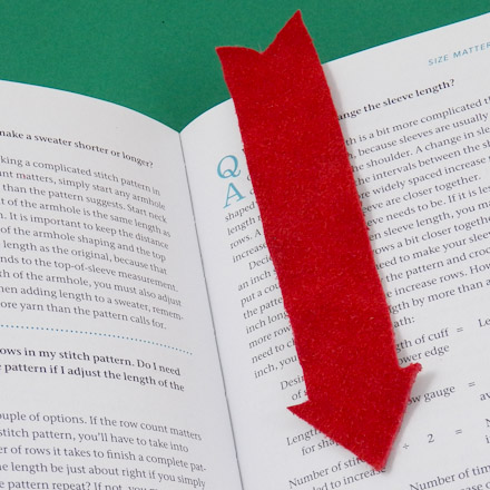 Arrow bookmark made of red suede