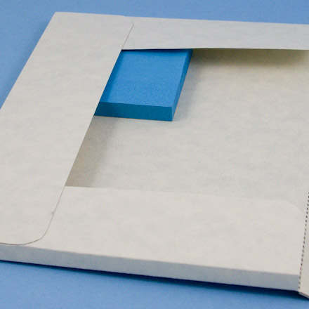 Use pad of sticky notes to help glue a square corner.