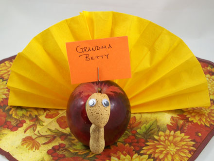 Turkey place card made from an apple and a napkin